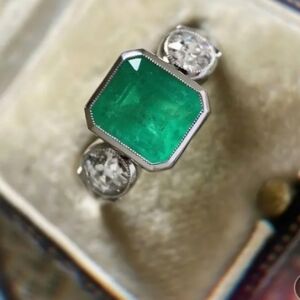 Green Simulated Emerald and Silver Ring With 2 round simulated diamonds